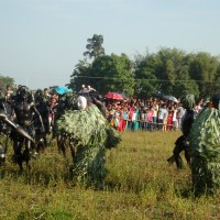 Bohua dancers performing with accompanied evils