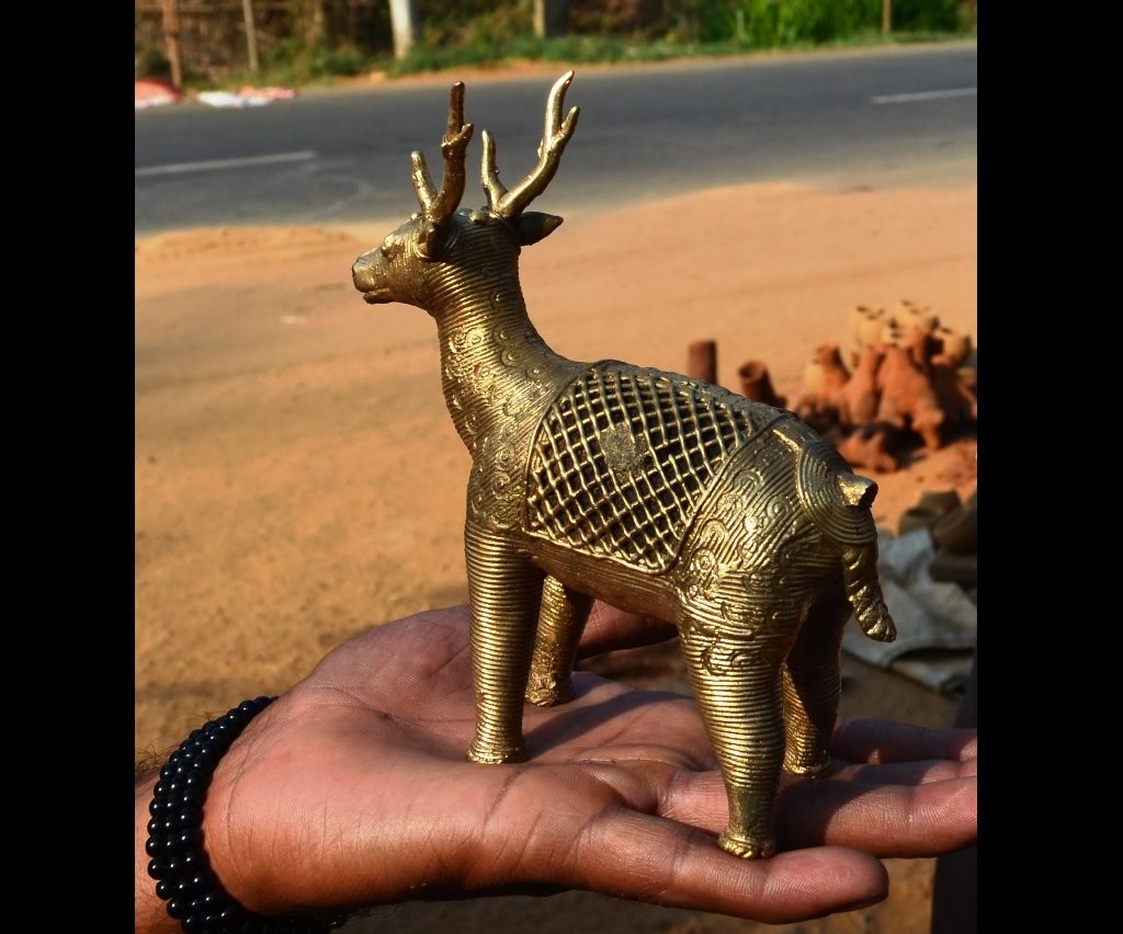 a final brass casted object in the shape of a deer
