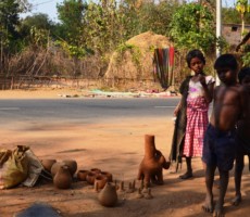 the community children posing next to the clay moulds