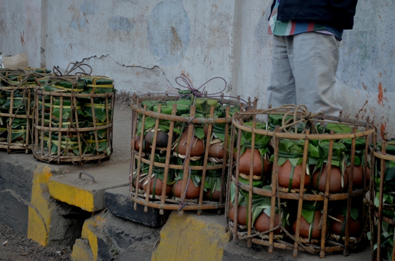 bamboo containers carrying curd